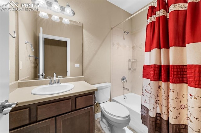 full bathroom featuring vanity, toilet, and shower / tub combo with curtain