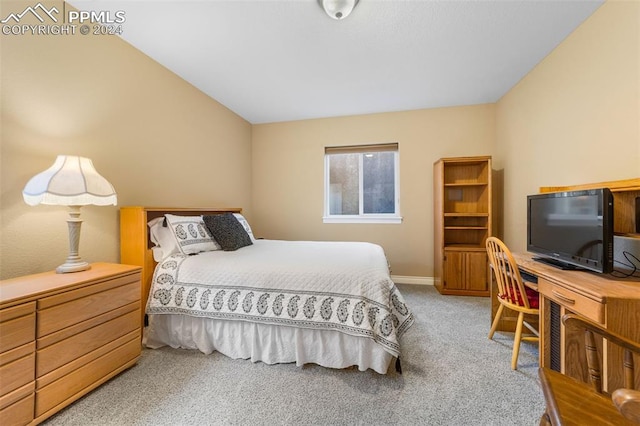 bedroom featuring carpet flooring and lofted ceiling