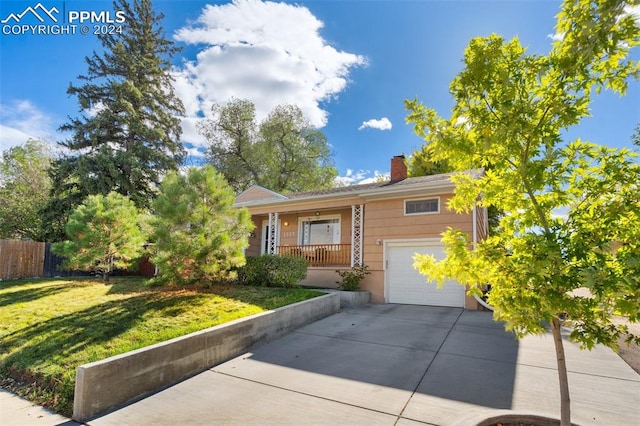 ranch-style home featuring a front lawn and a garage