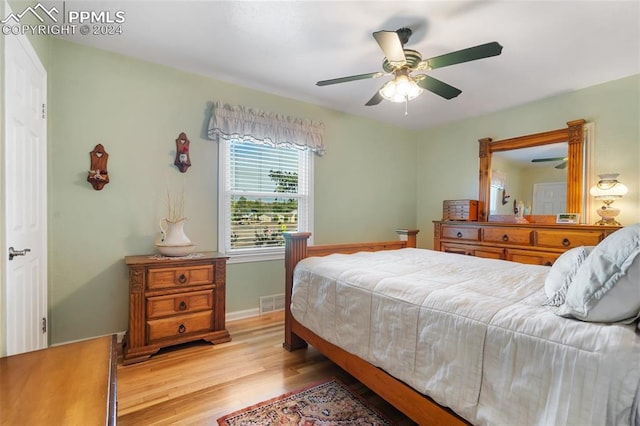 bedroom with ceiling fan and light wood-type flooring