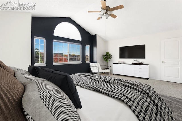 bedroom featuring carpet, vaulted ceiling, and ceiling fan