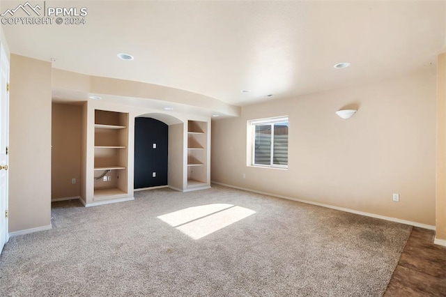 empty room with carpet flooring