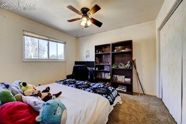 bedroom featuring carpet floors, a closet, and ceiling fan