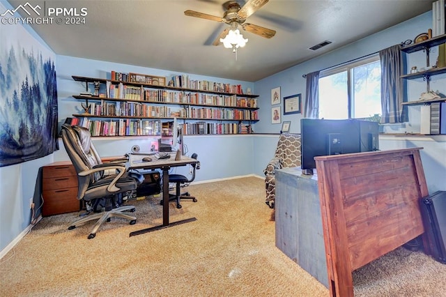 carpeted office with ceiling fan