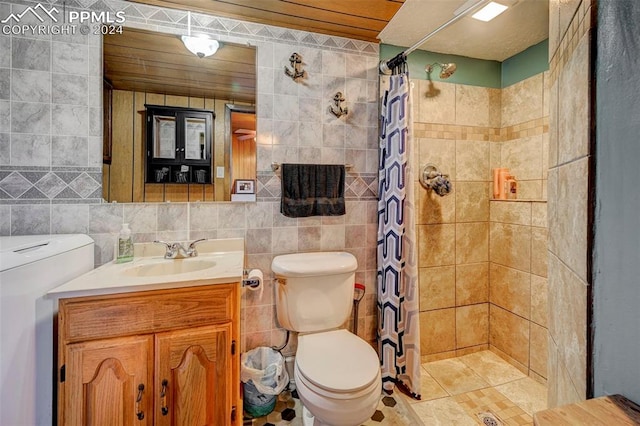 bathroom with toilet, walk in shower, vanity, and tile walls