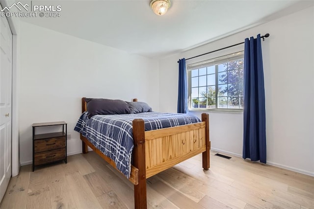 bedroom with wood-type flooring