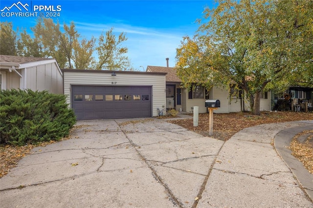 ranch-style home with a garage