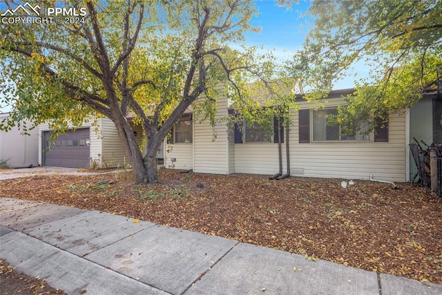 view of side of property featuring a garage