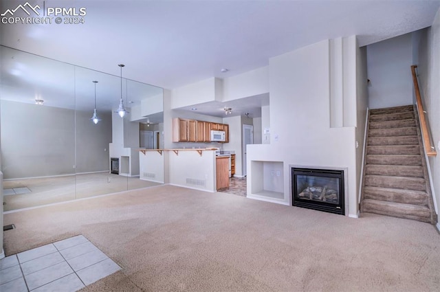 unfurnished living room with light carpet