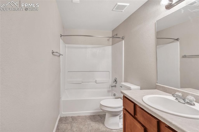 full bathroom featuring toilet, vanity, tile patterned floors, and bathtub / shower combination