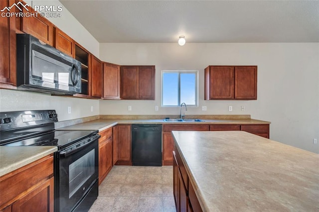 kitchen featuring black appliances and sink