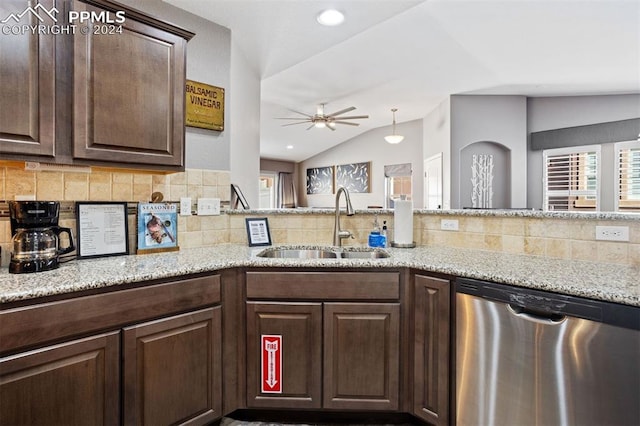 kitchen featuring dishwasher, lofted ceiling, backsplash, sink, and dark brown cabinetry