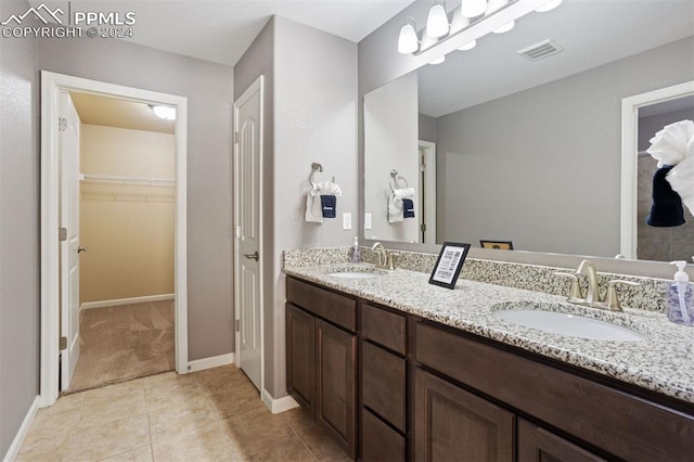 bathroom with tile patterned floors and vanity