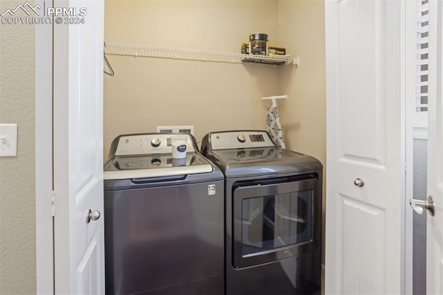 laundry room with independent washer and dryer