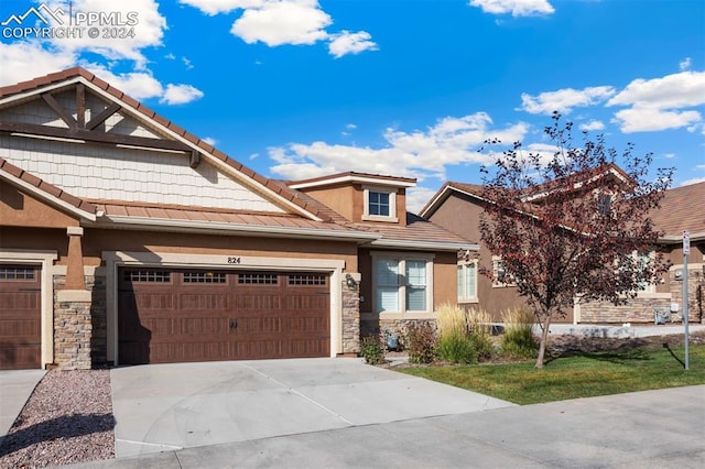 view of front of property featuring a garage