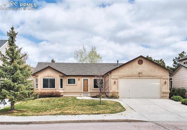 single story home with a front lawn and a garage