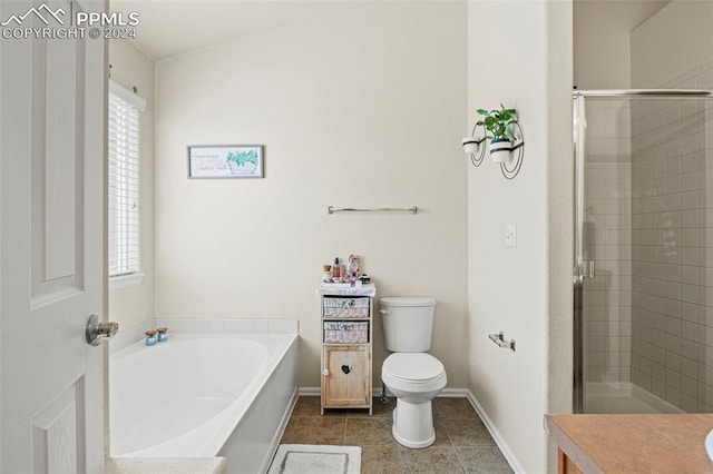 full bathroom featuring vanity, shower with separate bathtub, toilet, and tile patterned floors