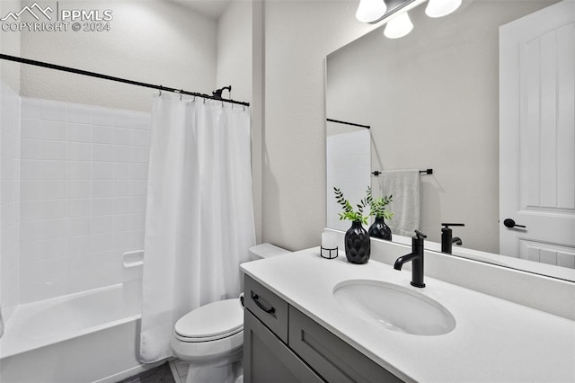 full bathroom featuring toilet, vanity, and shower / bath combo with shower curtain