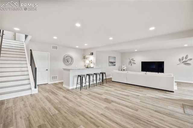 unfurnished living room featuring light hardwood / wood-style flooring