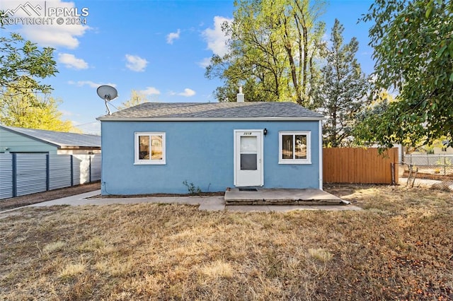 rear view of property featuring a patio area