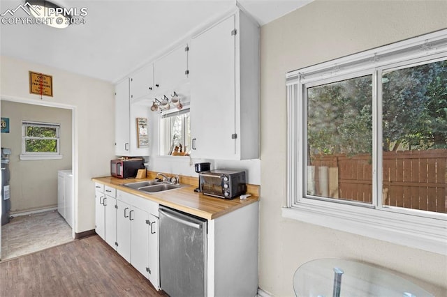 kitchen featuring white cabinetry, sink, and dark hardwood / wood-style flooring