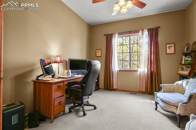 office area featuring baseboards, visible vents, a ceiling fan, and light colored carpet