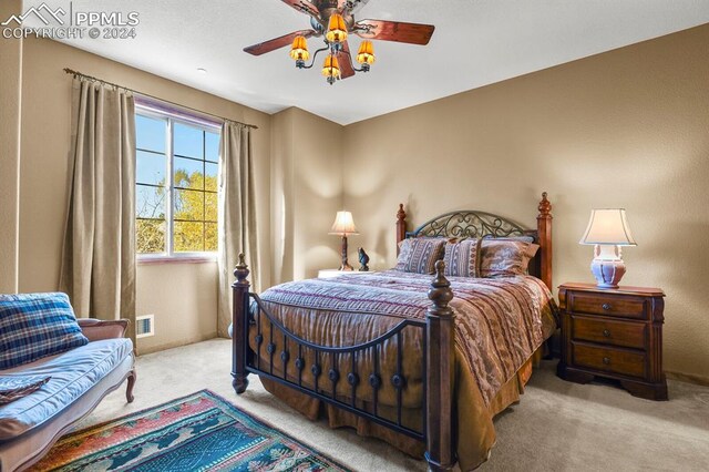 carpeted bedroom featuring ceiling fan