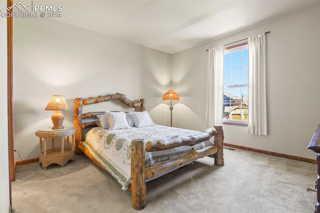bedroom with visible vents, baseboards, and carpet floors