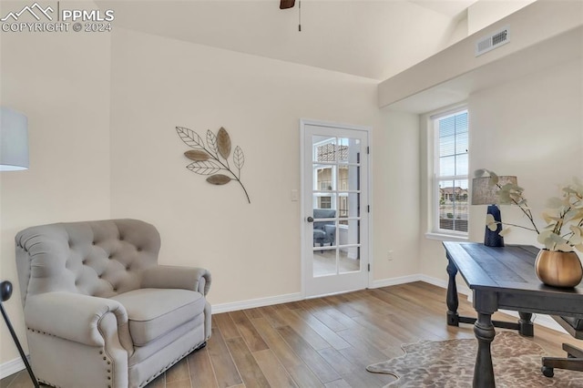 sitting room featuring light wood-type flooring and ceiling fan