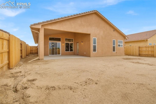 rear view of house with a patio area