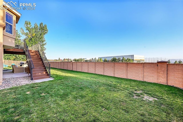 view of yard with a wooden deck