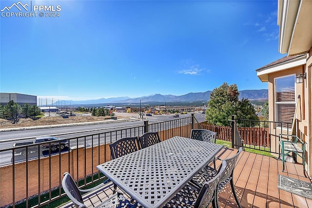 wooden terrace featuring a mountain view