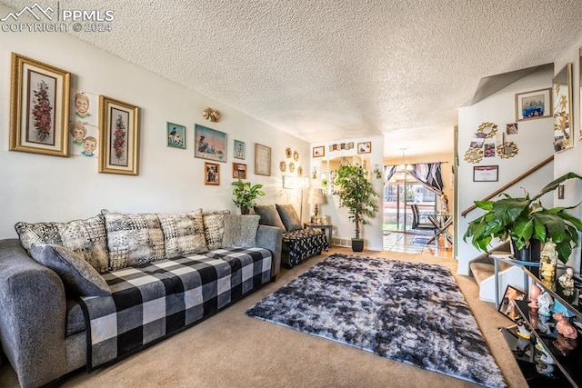 carpeted living room with a textured ceiling