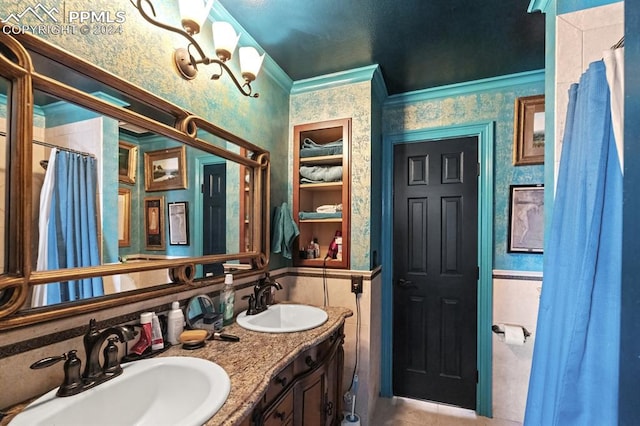 bathroom with vanity, ornamental molding, and tile patterned floors