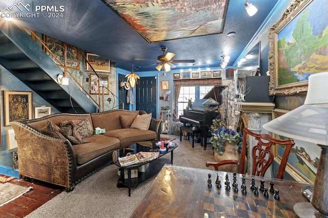 carpeted living room with ceiling fan, ornamental molding, and a textured ceiling