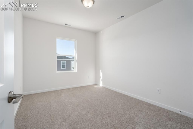 unfurnished room with carpet