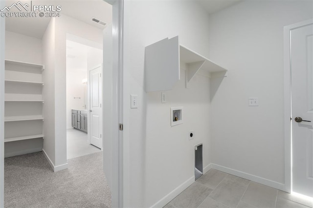 laundry room featuring light carpet, hookup for a washing machine, and hookup for an electric dryer