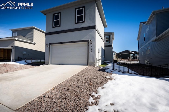 view of front of property with a garage