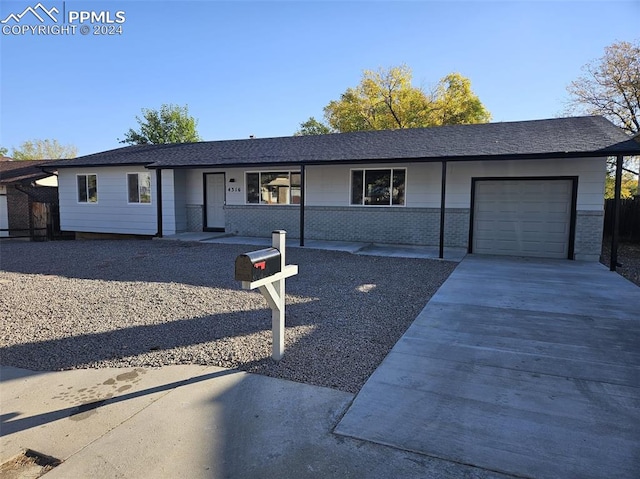 ranch-style home with a garage