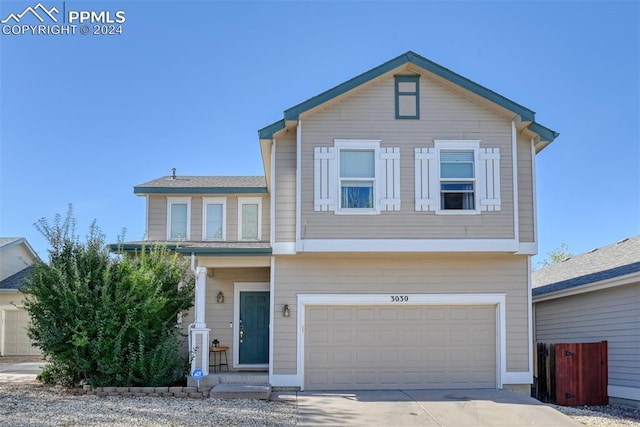 view of front of property with a garage