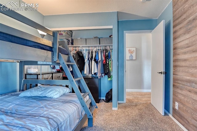 carpeted bedroom featuring a closet