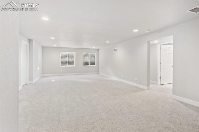 empty room with light colored carpet