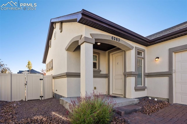 entrance to property featuring a garage