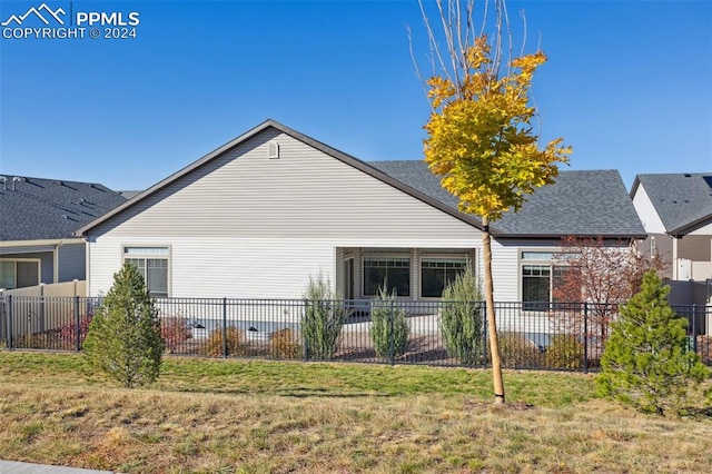 view of home's exterior with a yard