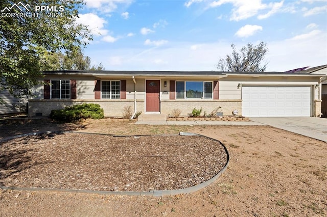 ranch-style house featuring a garage