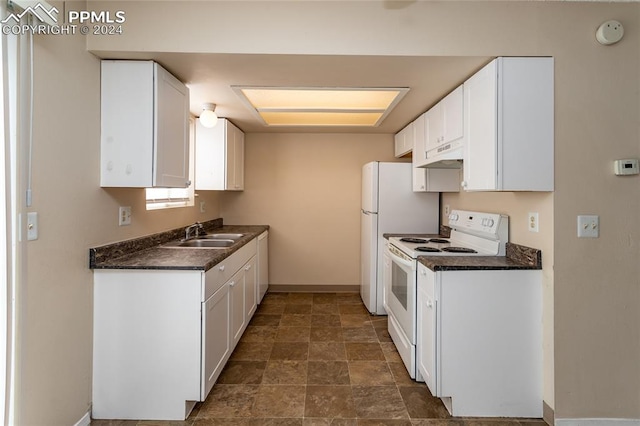 kitchen with sink, white cabinetry, and electric stove