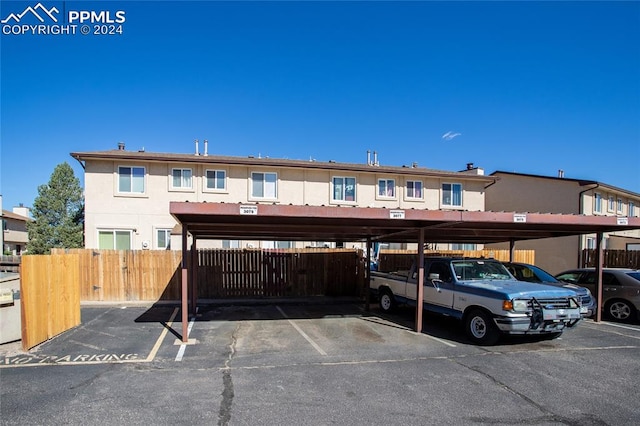 view of vehicle parking with a carport