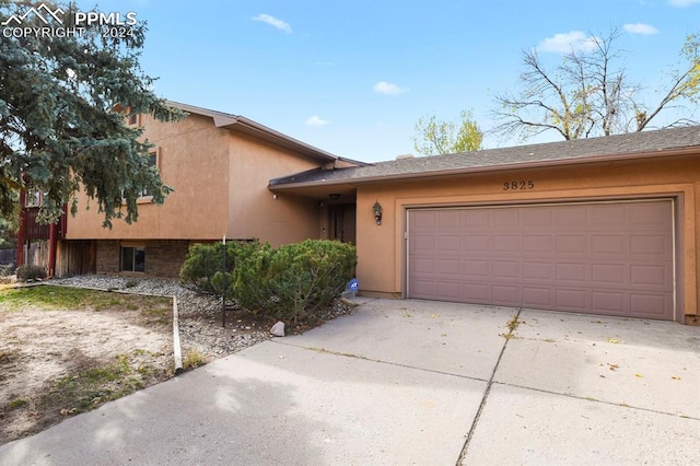 view of front of property with a garage