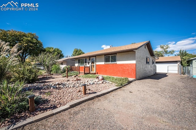 ranch-style house featuring a garage