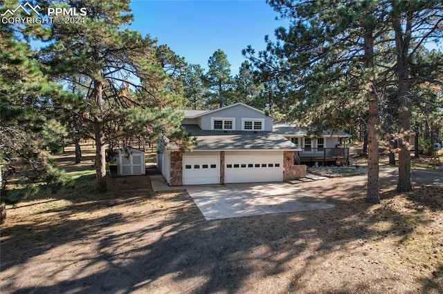 view of front of house featuring a wooden deck and a garage